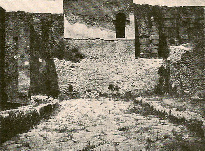 VI.7.26 on left.  From model in Naples Archaeological Museum.
North end of VI.9.1 on right showing site of street altar and wall now gone. 
