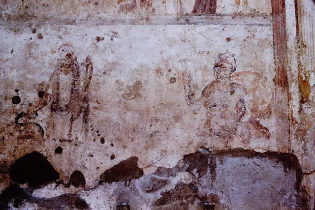 IX.11.1. Detail of painted figure, perhaps one of the two Lares. December 2006.