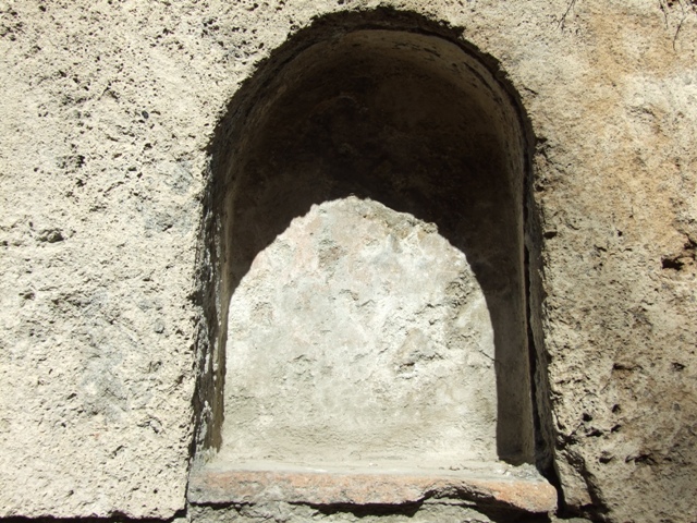The buried altar under the small niche.