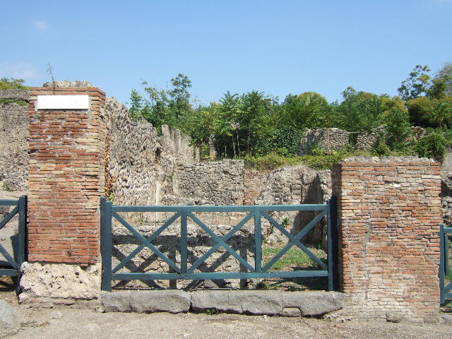 I.1.9 Pompeii. September 2010. Detail front of counter, looking west towards Via Stabiana. Photo courtesy of Drew Baker.
