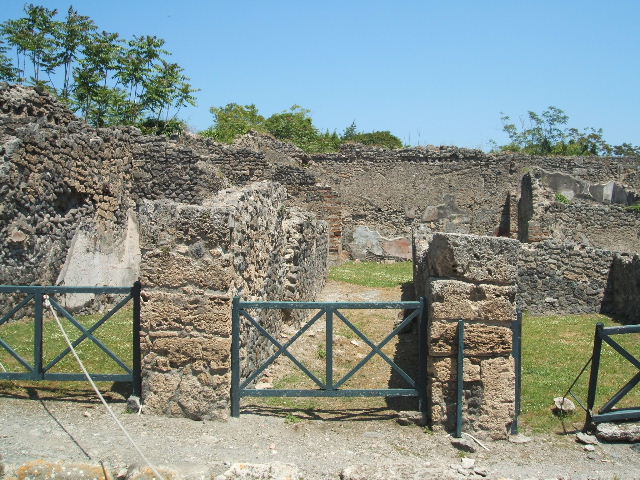 1.2.6 Pompeii. September 2010. Looking south across atrium, towards remains of south perimeter wall, and house I.2.3. Photo courtesy of Drew Baker