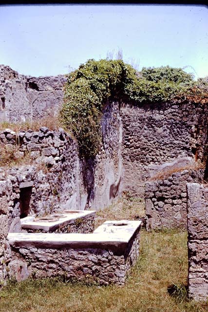 I.2.8 Pompeii.  March 2009.    Looking east to rear room.