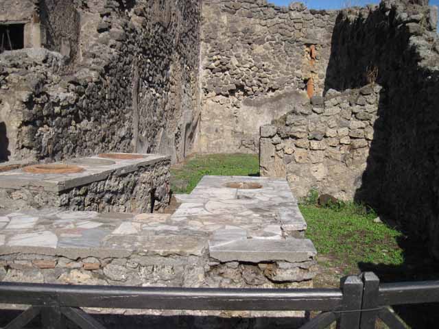 I.2.8 Pompeii.  December 2007.  South wall with doorway linking to I.2.7..

.