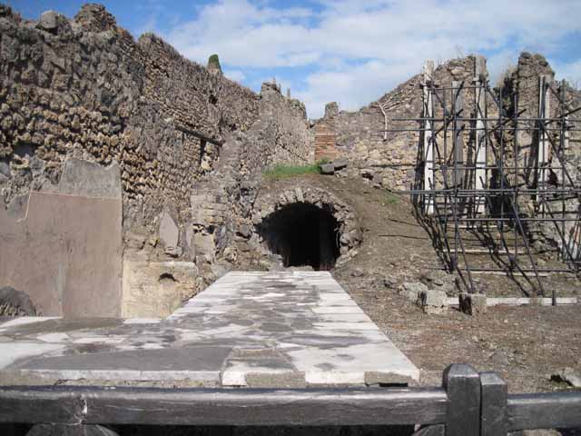 I.2.13 Pompeii. September 2010. On the left is the site of the small room.
On the right is the doorway of I.2.14, which would have had a staircase leading up to an independent property above. Photo courtesy of Drew Baker.
