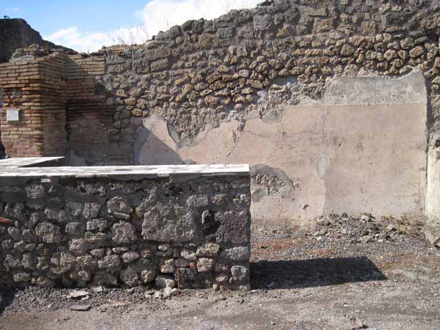 I.2.13 Pompeii. September 2005.  The area at the front, right, of the picture corresponds to the rear room of both I.2.12 and I.2.13.
