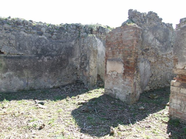 I.2.15 Pompeii. September 2010. East wall with doorway to atrium, of room on south side of corridor. Photo courtesy of Drew Baker.