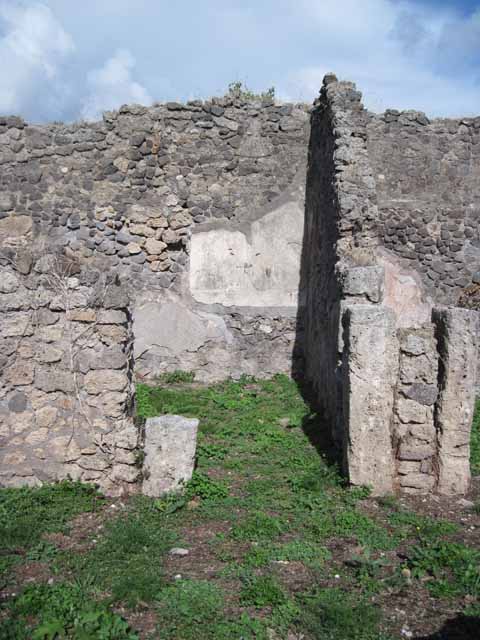 1.2.16 Pompeii. September 2010. Looking west through doorway in west wall of room 2, into north portico of room 1. Photo courtesy of Drew Baker