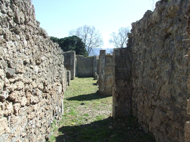 I.2.16 Pompeii. March 2009. Room 1, north-east corner of portico.
Looking south along north and east portico surrounding the garden on two sides.