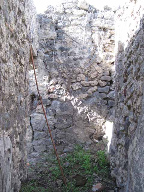 I.2.17 Pompeii. September 2010. Looking north to doorways to rooms 2 and 3 in north-east corner of atrium. Photo courtesy of Drew Baker.
