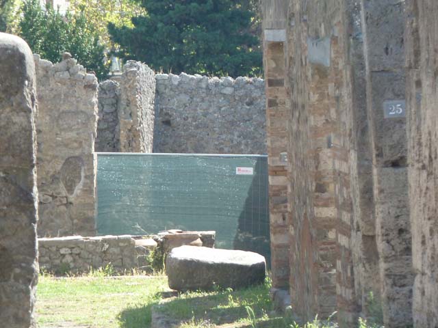 I.2.18 Pompeii. September 2010. Looking south into small room in south-east corner, ?latrine and kitchen?. Photo courtesy of Drew Baker.
According to Fiorelli, the room with the latrine had a hollow in the wall for placing a lamp. See Pappalardo, U., 2001. La Descrizione di Pompei per Giuseppe Fiorelli (1875). Napoli: Massa Editore. (p.36)
According to Boyce, in the south-west corner of the kitchen, built in a peculiar manner, was an arched niche. (height 0.30, w.0.30, d.0.25, height above the floor 1.30). See Boyce G. K., 1937. Corpus of the Lararia of Pompeii. Rome: MAAR 14. (p.22, no.12).