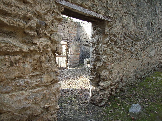 I.2.19 Pompeii. March 2009. Rear entrance doorway, and room on south side of doorway.  Taken from doorway from I.2.17. Looking south-east.

