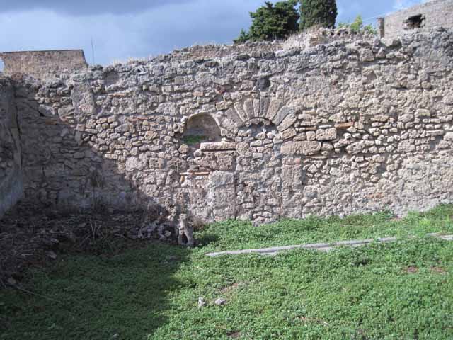 I.2.20 Pompeii. March 2009. Site of staircase to upper floor, and two small rear rooms in south west corner of garden area.