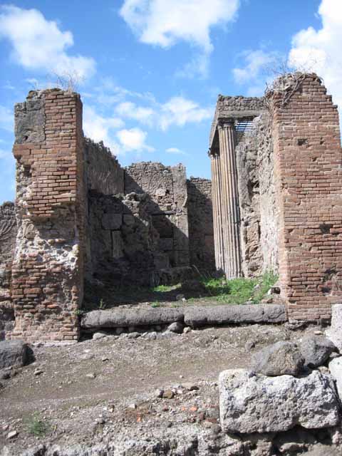 I.2.29 Pompeii. September 2010. Looking north from entrance doorway towards north wall that had a doorway into the atrium of I.2.28.
Photo courtesy of Drew Baker. The decorative serving table, counter or podium would have been on the left and centre of the photo.
According to Garcia y Garcia, this bar was destroyed completely by a bomb. The perimeter walls have been reconstructed, but the three steps to the entrance, the sales counter and the electoral inscriptions have been lost forever. See Garcia y Garcia, L., 2006. Danni di guerra a Pompei. Rome: L’Erma di Bretschneider. (p.37)