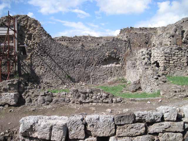 I.2.30 Pompeii. September 2010. Remains of east wall, at front of photo.
Photo courtesy of Drew Baker.
