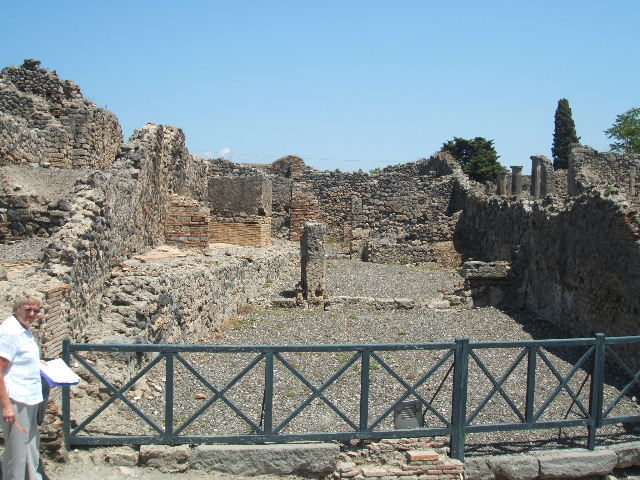 I.3.9 Pompeii. September 2010. South wall of entrance room and south-east corner.
This area would have been linked to area of I.3.10. On the left, the doorway to the first rear room can be seen. Photo courtesy of Drew Baker.
