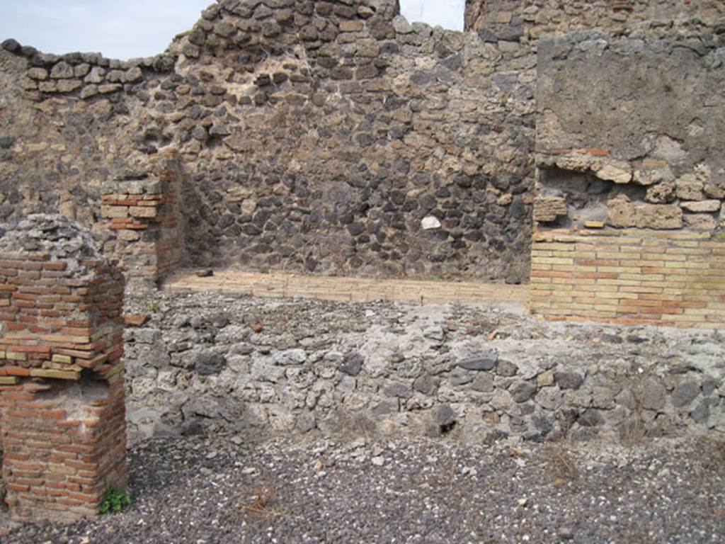 I.3.10 Pompeii. September 2010. Looking north towards north-west corner of ruined room, from first room on the south side. The inspection house for the Sarno canal can be seen on the right. Photo courtesy of Drew Baker.
