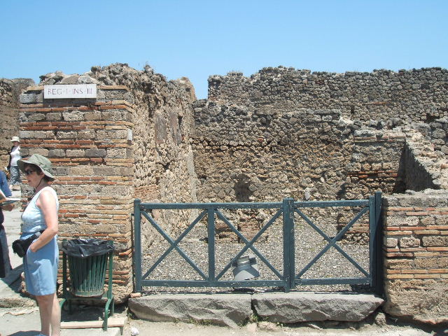 I.3.12 Pompeii. December 2007. South wall and doorway to rear room in south-east corner.