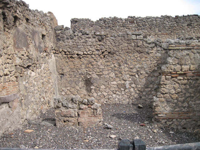 I.3.12 Pompeii. Shop. North wall and rear room in north east corner.