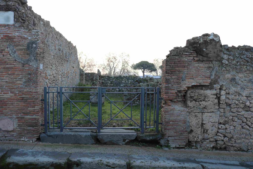 I.3.13 Pompeii. December 2018. Looking south to entrance doorway in Vicolo del Menandro. Photo courtesy of Aude Durand.
