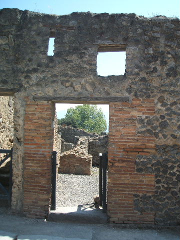 I.3.16 Pompeii. December 2007. Recesses at north end of west wall above podium.