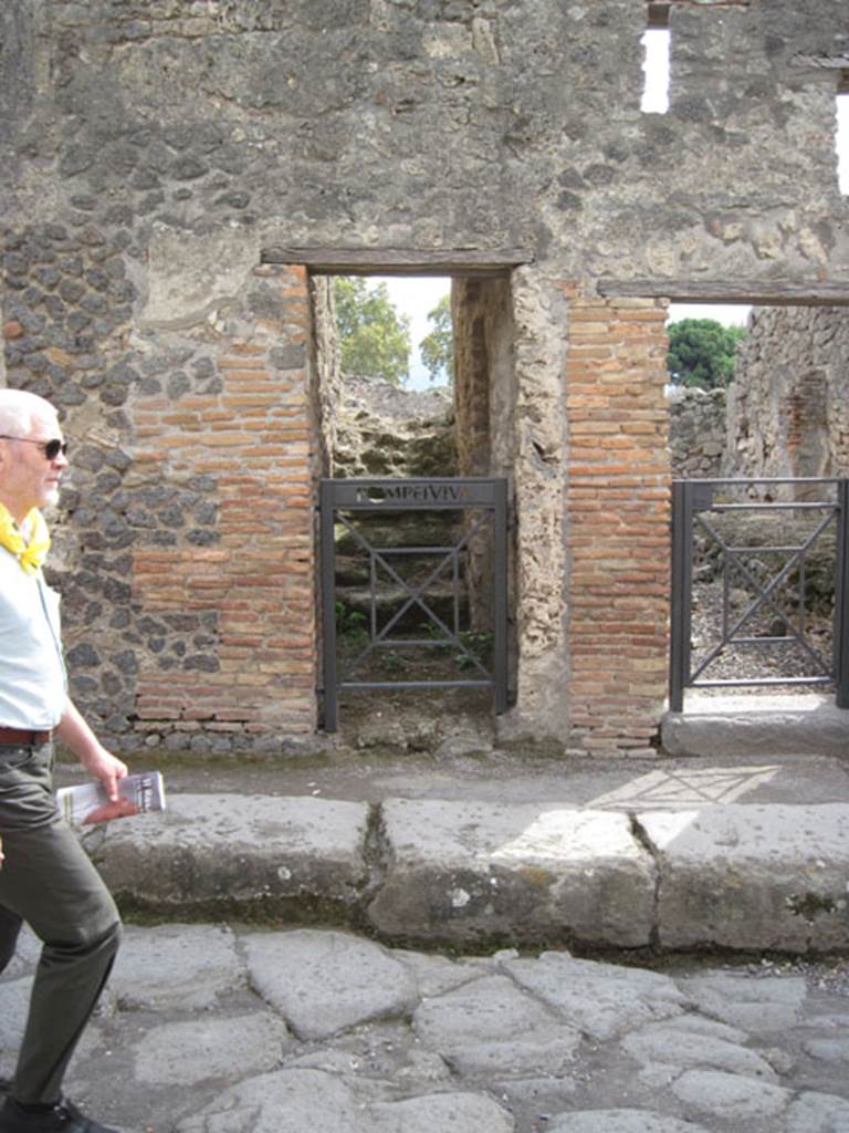I.3.17 Pompeii. September 2010. Looking south towards entrance doorway, across Vicolo del Menandro. Photo courtesy of Drew Baker.
