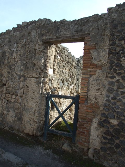 I.3.19 Pompeii. September 2010. Looking south from entrance doorway of steps to upper floor. Ahead can be seen the blocked doorway in the south wall of I.3.18. Photo courtesy of Drew Baker.
