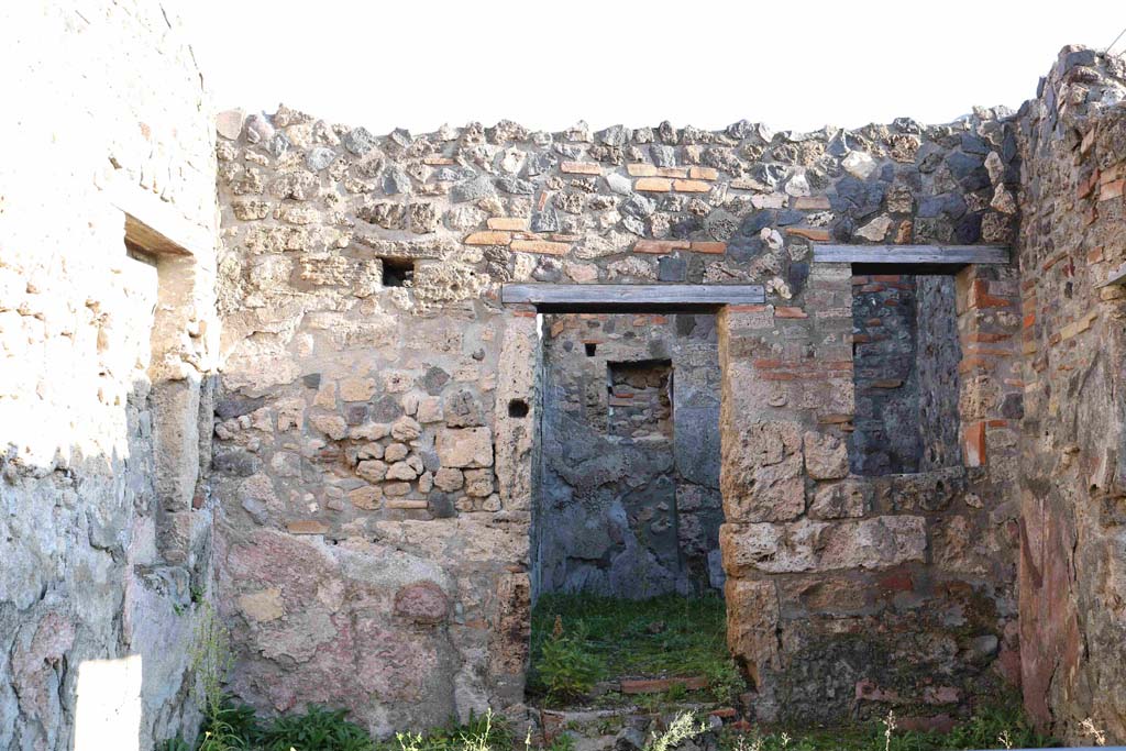 I.4.4 Pompeii. December 2018. Looking towards east wall of shop with doorway to rear room. Photo courtesy of Aude Durand.