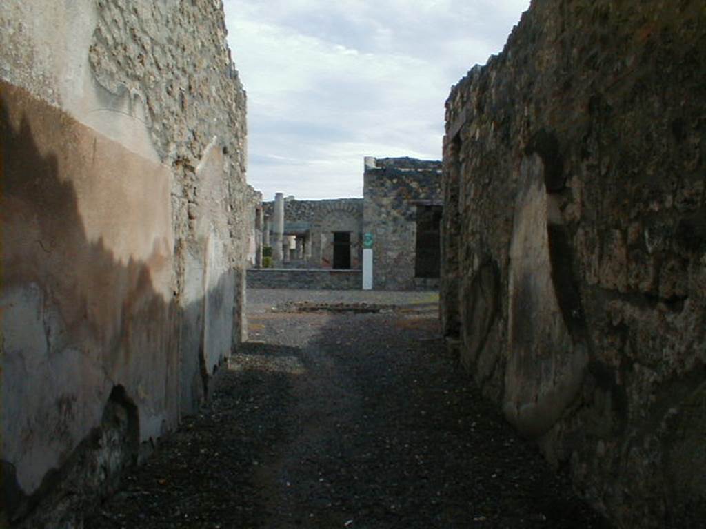 I.4.5 South side of exterior wall looking west along Vicolo del Menandro.  