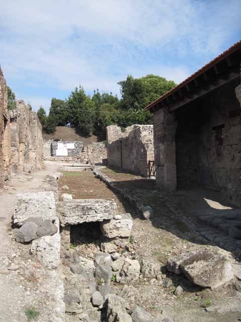 I.5.1 Pompeii. September 2010. Entrance with restored portico looking south towards rear. Photo courtesy of Drew Baker.