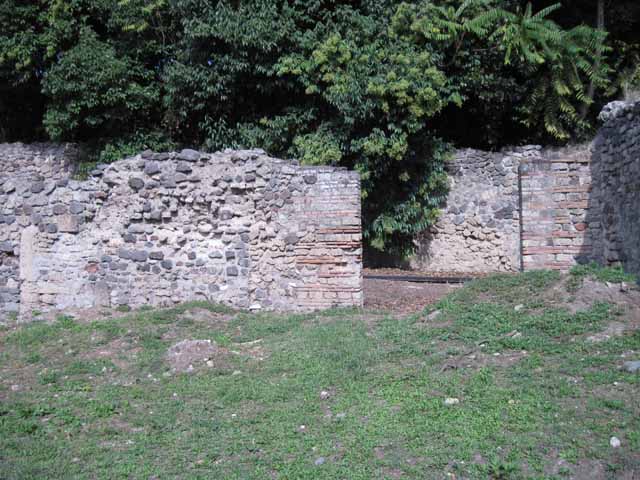 I.5.3 Pompeii. September 2010. Niche in west wall of large open area.
Photo courtesy of Drew Baker. Boyce reported that there was an arched niche in the west wall with projecting floor. See Boyce G. K., 1937. Corpus of the Lararia of Pompeii. Rome: MAAR 14. (p.25) 

