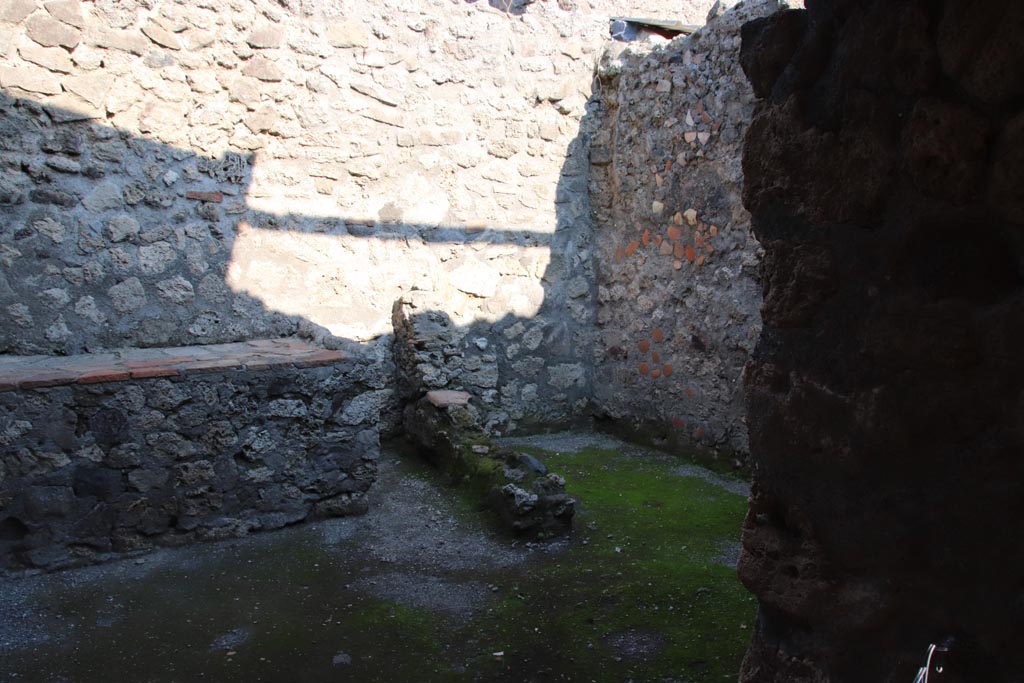 I.6.4 Pompeii. October 2022. Room 8, looking south-east through doorway into kitchen and latrine. Photo courtesy of Klaus Heese. 

