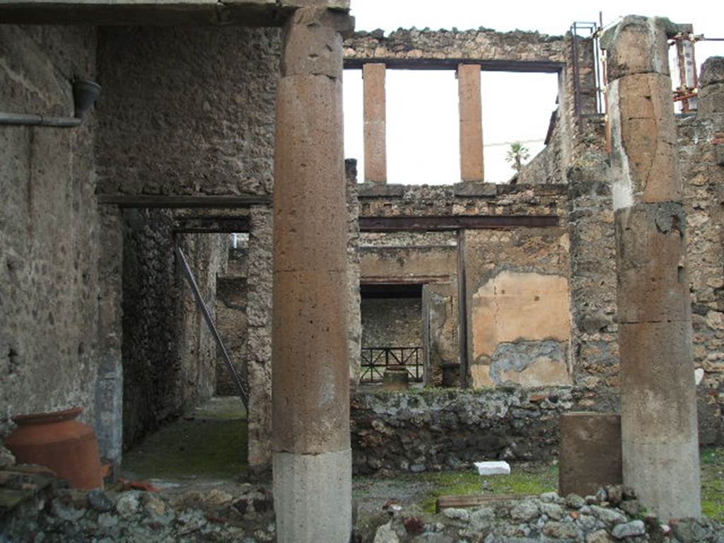 I.6.9 Pompeii. December 2004. Looking across peristyle to tablinum and towards I.6.8, photo taken from rear of house..