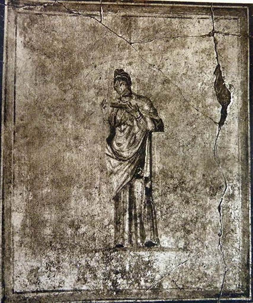 I.7.14 Pompeii. Old undated photograph showing female figure in a long robe. 
She held in her raised hands an object possibly a scroll.  
She was identified as possibly the Muse, Calliope. 
The painting was part of the decoration, on a white background, of the upper north wall of the cenacolo of the upper floor.
