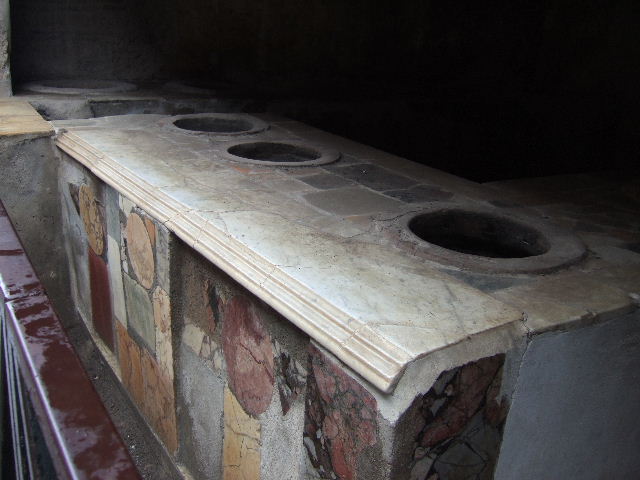 I.8.8 Pompeii. May 2010. East wall and three-sided counter.