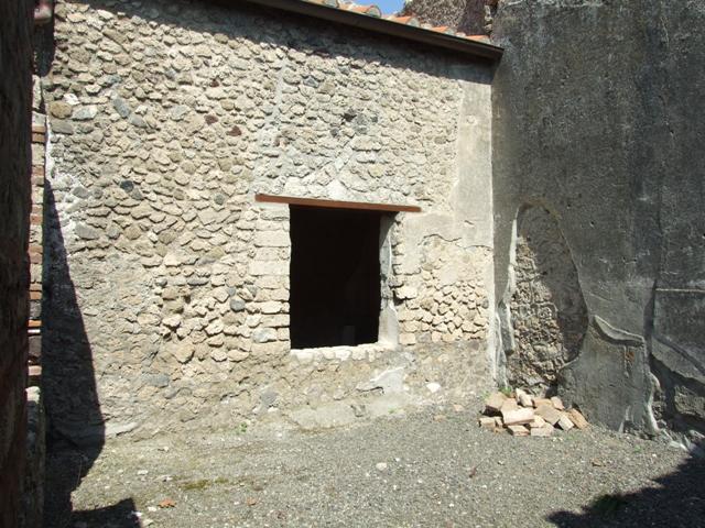 I.10.8 Pompeii. March 2009. Room 3. South wall. West End, with painted plaster between the window and door.