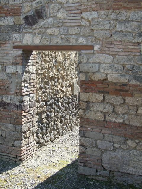 I.10.8 Pompeii. March 2009. Room 14, arched niche lararium in east wall of garden area.