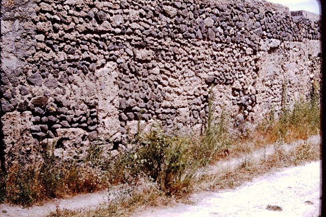 I.11.10 Pompeii. December 2006. Aedicula lararium on east wall with masonry altar in front of it.