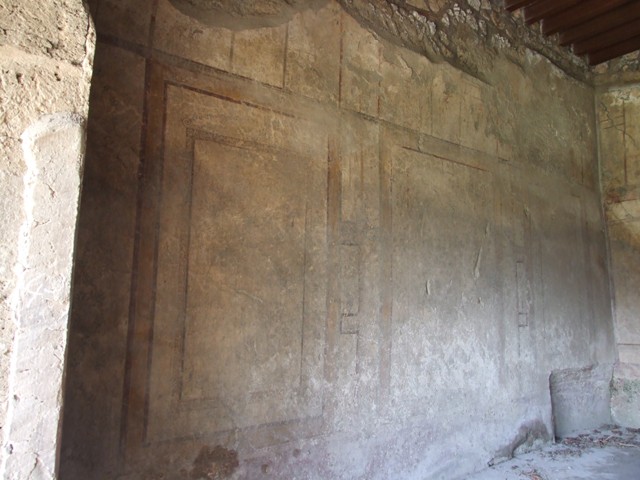 I.12.2 and I.12.1 Pompeii.  March 2009.  Room 7. Triclinium.  East wall with door to corridor room 6.