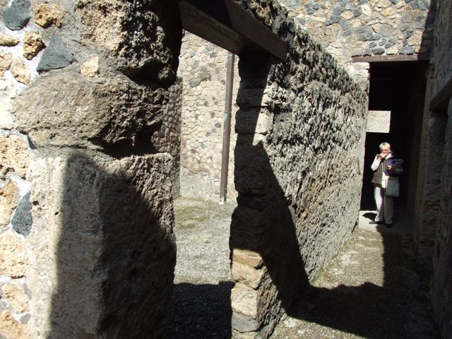 I.12.2 and I.12.1 Pompeii.  March 2009 Room 14.  Small area behind the south wall.