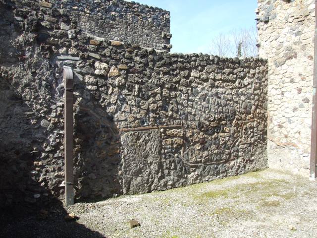 I.12.2 and I.12.1 Pompeii.  March 2009.  Room 15. Latrine.  East wall.