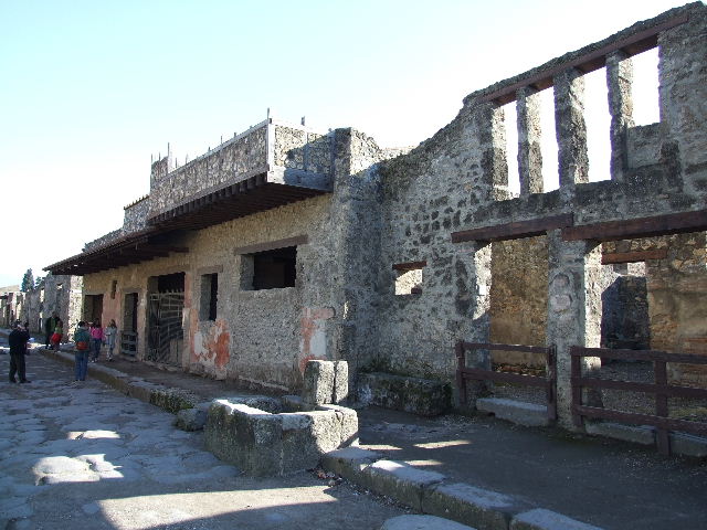 I.12.2 and I.12.1 Pompeii.  March 2009.  Room 1, looking east to bakery in room 3.

 

