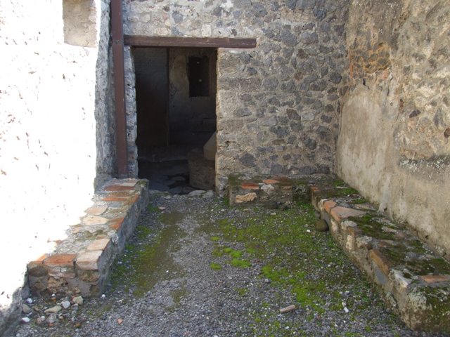 I.12.1 and I.12.2 Pompeii. May 2010. Room 2, with doorway in east wall to room 4, and window in south wall to room 7. Looking south.

