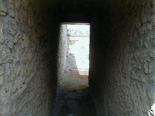 I.12.9 Pompeii. December 2007. Looking north to garden at I.12.14, across room in north-west corner.