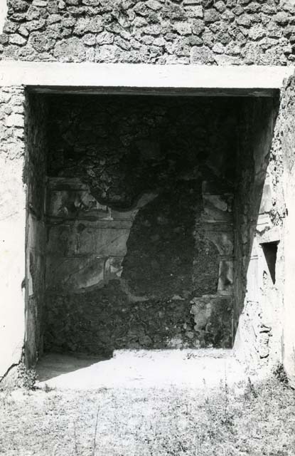 I.13.2 Pompeii. May 2010. Kitchen, north wall. Painted lararium with niche, and serpent below.