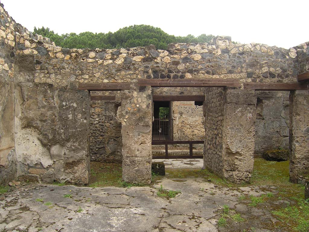 I.14.2 Pompeii. July 2008. Room B, looking east across atrium towards rooms on either side of entrance corridor.
On the left is the doorway to room C, on the right is the doorway to room D.
Photo courtesy of Guilhem Chapelin. 
