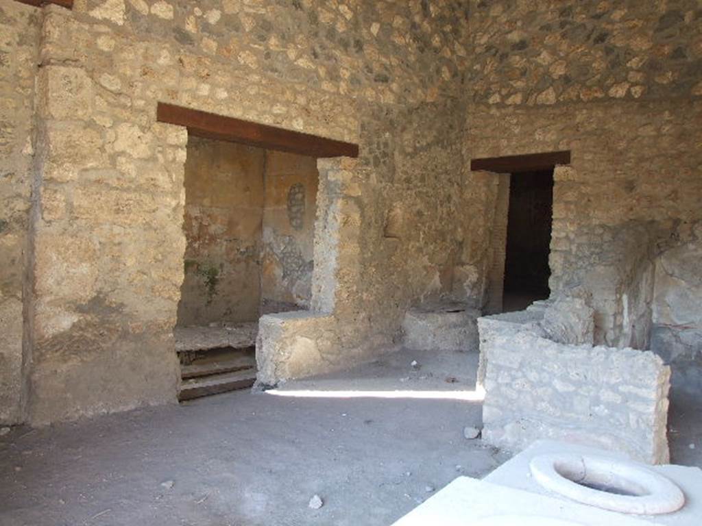 I.14.15  Pompeii.  December 2006. West side of bar, with doorways to rooms on west and north side.