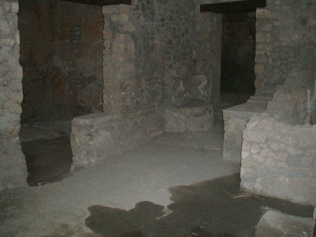 I.14.15  Pompeii.  December 2004. West side of bar, with doorways to rooms on west and north side.