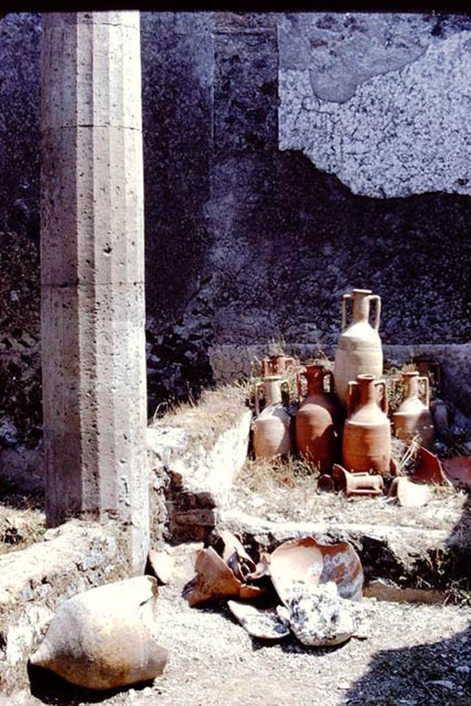 I.15.3 Pompeii. 1972. Pots and amphorae at east end of south portico 10 in peristyle 13. Photo by Stanley A. Jashemski. 
Source: The Wilhelmina and Stanley A. Jashemski archive in the University of Maryland Library, Special Collections (See collection page) and made available under the Creative Commons Attribution-Non Commercial License v.4. See Licence and use details. J72f0639
