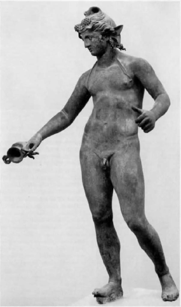 I.16.2, Pompeii. Bronze statue of a young Bacchus.
Found in a cubiculum adjacent to the fauces, on 26th September 1957. 
Then on display in Pompeii Antiquarium, see VIII.1.4. SAP inv. No. 11864.
It was found with many other bronze household goods/furnishings in a cubiculum of the atrium. 
See Elia, O., 1961. Bacco Fanciullo e Dioniso Chtonio a Pompei: Bollettino dArte 1961, Fasc I-II, (p.1.fig.1). 
See Rediscovering Pompeii, IBM catalogue, 1990-92, no.187, p.266-7.

