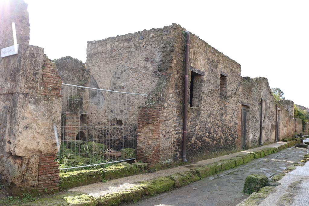 I.17.3 Pompeii, on left. December 2018. 
Looking south-west on Via di Castricio towards I.17.1, on right. Photo courtesy of Aude Durand.
